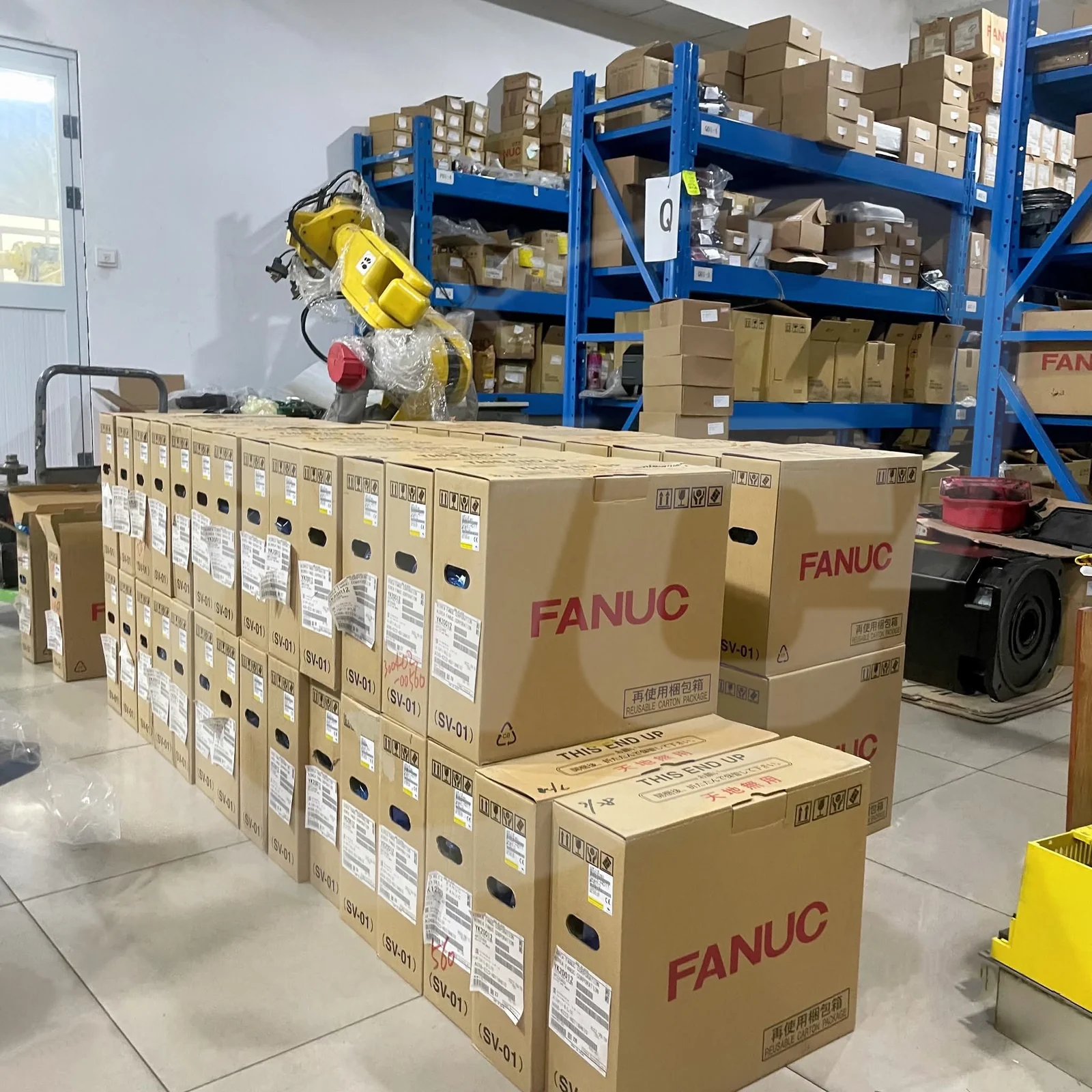 FANUC cartons and industrial robot equipment in the VCOCNC stockroom