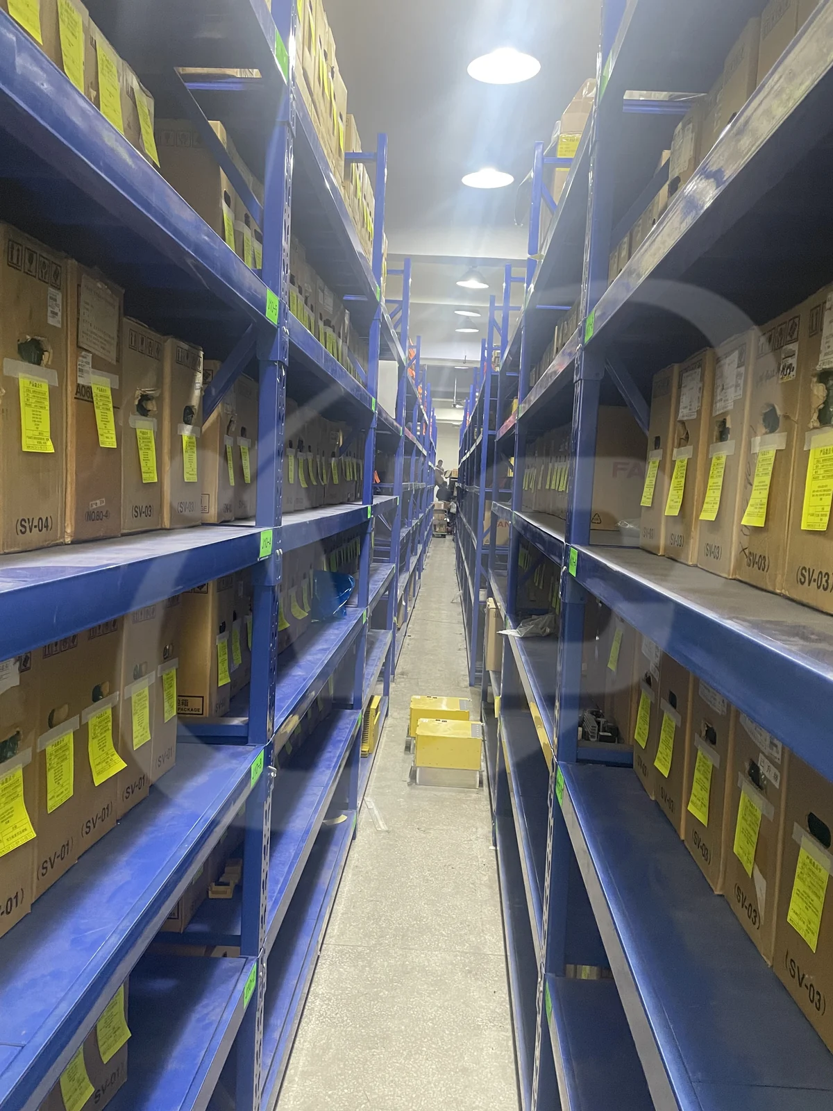 VCOCNC warehouse aisle with organized FANUC carton stock