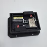 FANUC A02B-0236-C281 external battery case with the cover removed, showing internal wiring and retaining straps at an angle
