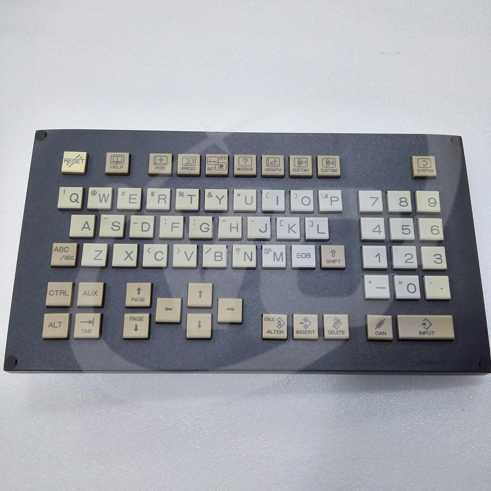 FANUC A02B-0303-C328 MDI keyboard front showing the QWERTY letter keys, numeric keypad and function keys