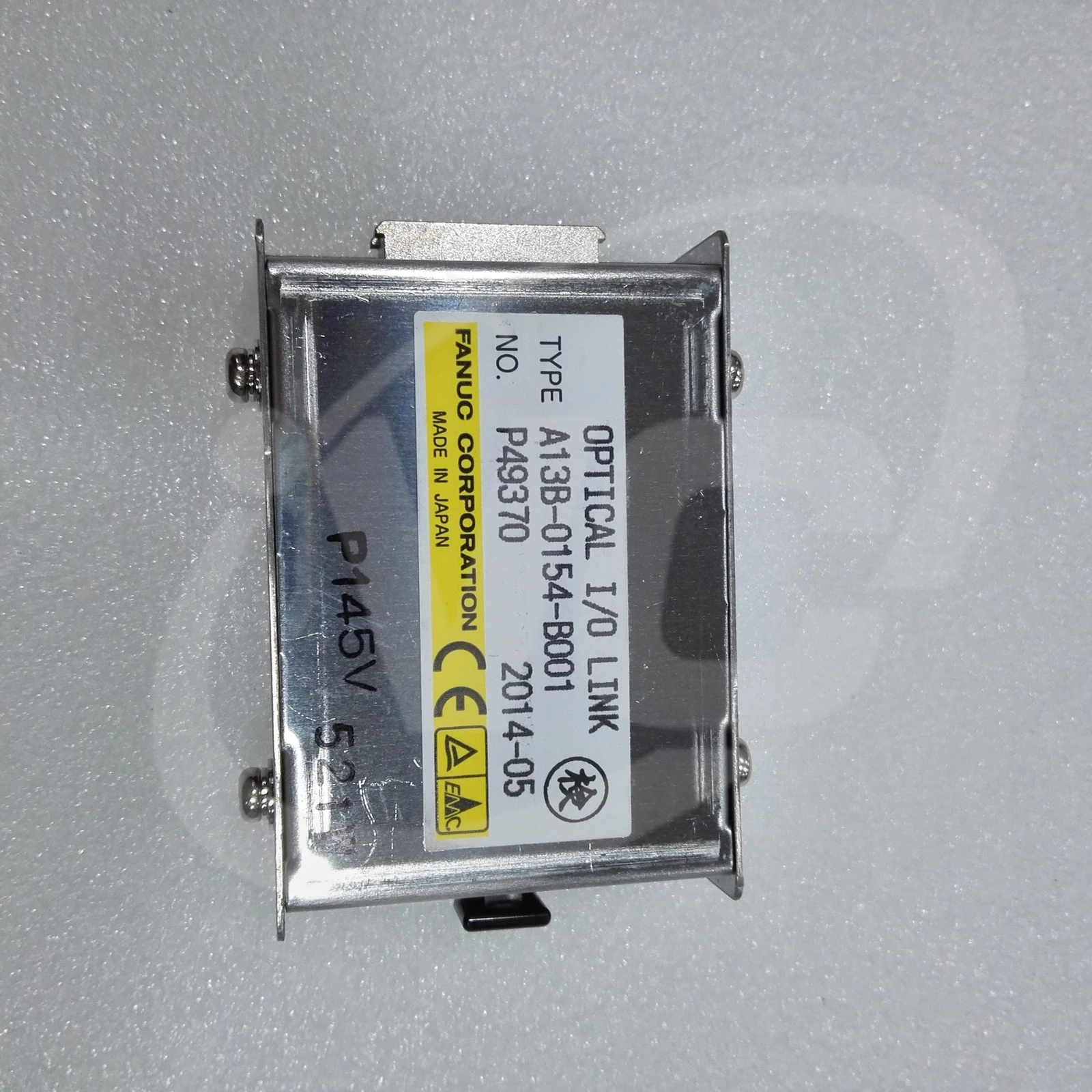 FANUC A13B-0154-B001 I/O Link optical adapter label face showing the FANUC nameplate on the metal housing